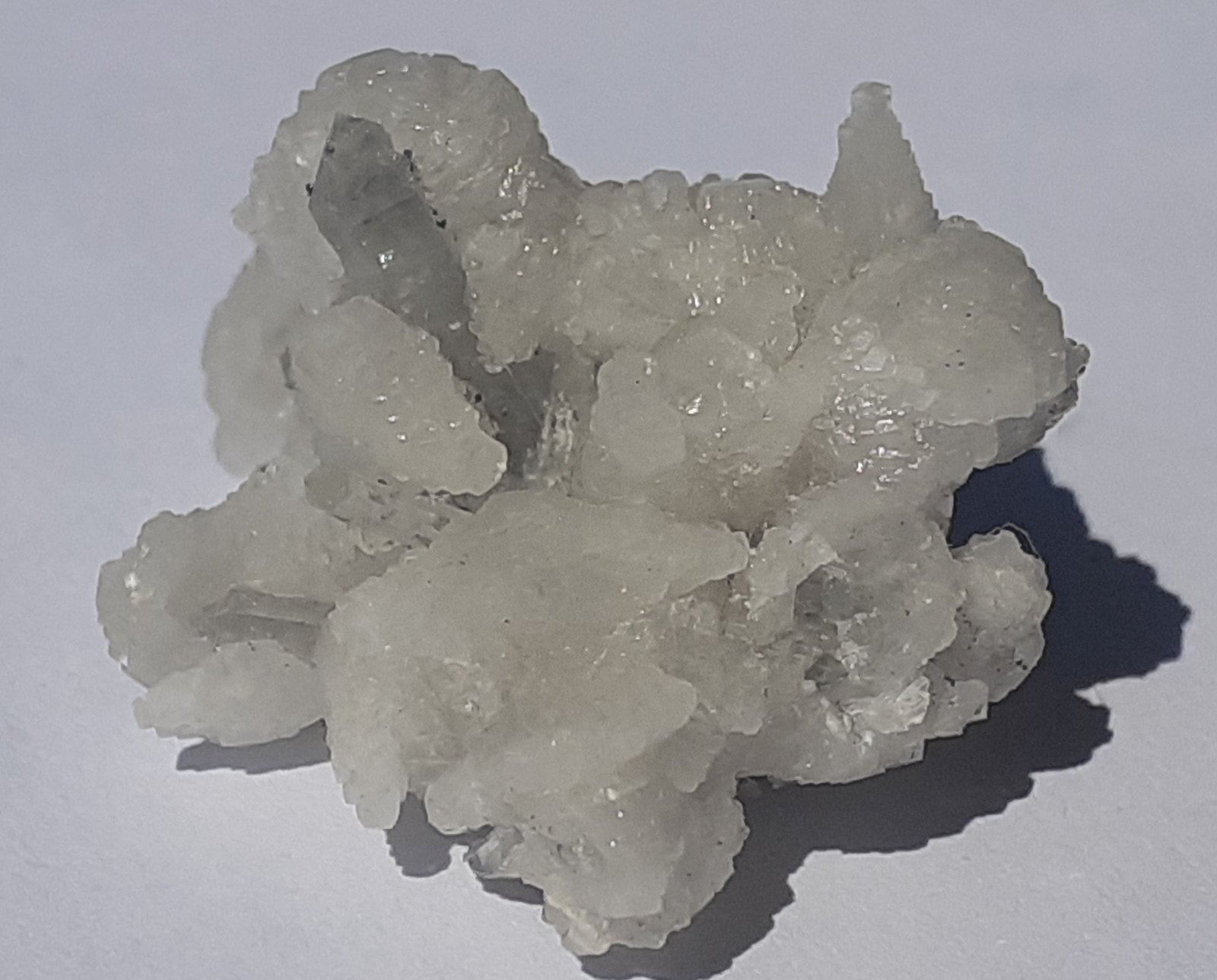 Quartz (variety smoky Quartz), Calcite
2 x 1,5 cm
(Autor: Volkmar Stingl)