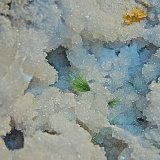 Honnessite?
geode is 15 cm; the largest spray ( best seen peeking out at the bottom center) is 3 cm
(Autor: Bob Harman)