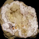 Calcite, Barite and Dolomite on Quartz
geode is 22 cm x 18 cm. The largest doubly terminated calcite (near the cavity center) is 7 cm
(Autor: Bob Harman)