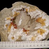 Calcite with Marcasite inclusions on Dolomite and Quartz
geode is about 14 cm,  cavity is about 10 cm, largest calcite is about 4.5 cm
(Autor: Bob Harman)