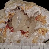 Calcite with Marcasite inclusions on Dolomite and Quartz
geode is about 14 cm,  cavity is about 10 cm, largest calcite is about 4.5 cm
(Autor: Bob Harman)