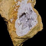 Aragonite or Kaolinite on Calcite on Quartz
Geode is 10 cm. the larger of the 2 Calcites is 2.5 cm
(Autor: Bob Harman)