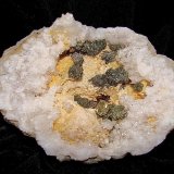 Marcasite on Dolomite on Quartz
The geode is 7.5 cm.   The marcasite groupings are about 1.0 cm - 2.4 cm
(Autor: Bob Harman)