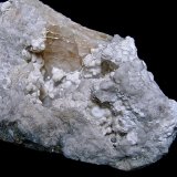 Strontianite, Baryte, and Quartz
The specimen is 13 cm. The strontianite hemispheres are 3 mm - 7 mm
(Autor: Bob Harman)